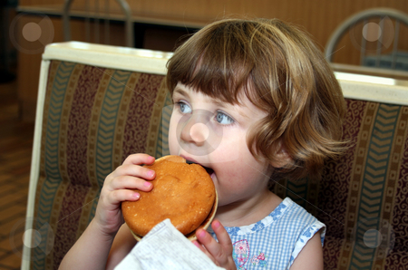 To use this stock image in your creative project, please select the size you need over to the right and click the "Add to Cart" button.
Your downloaded image will come with the Cutcaster watermark removed so don’t worry about the watermark you see on this page. Hamburger girl stock photo, Little girl eating hamburger in fast food restaurant by Anita Peppers