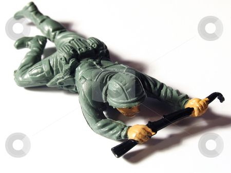 To use this stock image in your creative project, please select the size you need over to the right and click the "Add to Cart" button.
Your downloaded image will come with the Cutcaster watermark removed so don’t worry about the watermark you see on this page. Toy soldier crawling stock photo, Plastic toy army soldier crawling by Anita Peppers