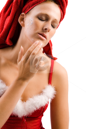 To use this stock image in your creative project, please select the size you need over to the right and click the "Add to Cart" button.
Your downloaded image will come with the Cutcaster watermark removed so don’t worry about the watermark you see on this page. Moisturizing my face stock photo, Studio portrait of a beautifull girl who is applying creme to her face by Frenk and Danielle Kaufmann