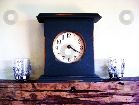 To use this stock image in your creative project, please select the size you need over to the right and click the "Add to Cart" button.
Your downloaded image will come with the Cutcaster watermark removed so don’t worry about the watermark you see on this page. 20 past 4 clock stock photo, on a mantlepiece with two candles either side by George Thurgood Howland
