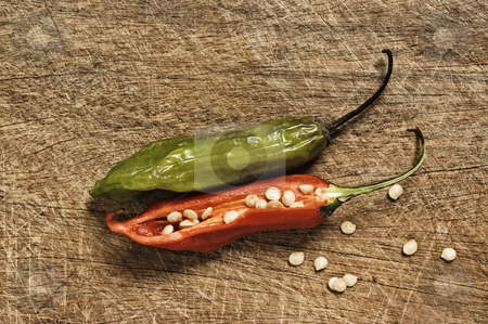 To use this stock image in your creative project, please select the size you need over to the right and click the "Add to Cart" button.
Your downloaded image will come with the Cutcaster watermark removed so don’t worry about the watermark you see on this page. Two chili peppers on a cutting table stock photo, Two chili peppers on a cutting table. by Pablo Caridad