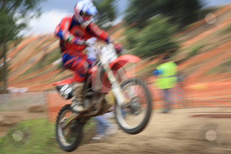 To use this stock image in your creative project, please select the size you need over to the right and click the "Add to Cart" button.
Your downloaded image will come with the Cutcaster watermark removed so don’t worry about the watermark you see on this page. Motorcross rider in motion stock photo, Motorcross rider, abstract image created with intentional motion blur and zooming effect. by Tilo