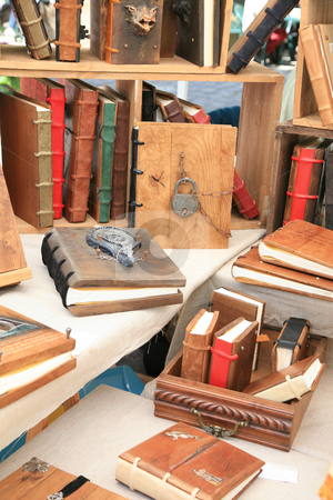 To use this stock image in your creative project, please select the size you need over to the right and click the "Add to Cart" button.
Your downloaded image will come with the Cutcaster watermark removed so don’t worry about the watermark you see on this page. Antique books stock photo, Antique wooden books with wooden covers by Tilo