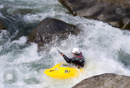 To use this stock image in your creative project, please select the size you need over to the right and click the "Add to Cart" button.
Your downloaded image will come with the Cutcaster watermark removed so don’t worry about the watermark you see on this page. Single kayaker in whitewater stock photo, A kayaker taking bit of spray in the face while negotiating some rapids between two large bouldera along the Wenatchee River by Mike Dawson