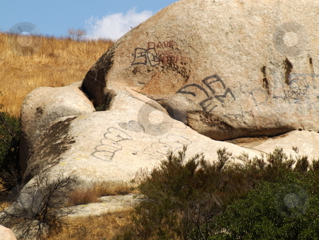 To use this stock image in your creative project, please select the size you need over to the right and click the "Add to Cart" button.
Your downloaded image will come with the Cutcaster watermark removed so don’t worry about the watermark you see on this page. Rock Formation with Graffiti stock photo, Rock Formation with Graffiti by Joseph Ligori
