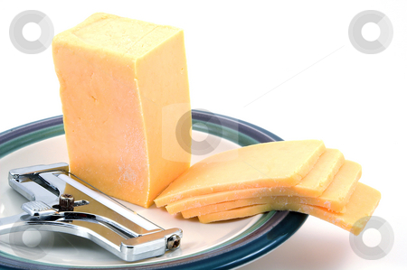 To use this stock image in your creative project, please select the size you need over to the right and click the "Add to Cart" button.
Your downloaded image will come with the Cutcaster watermark removed so don’t worry about the watermark you see on this page. Cheese and Slicer stock photo, A hunk of delicious sharp cheddar and a cheese slicer. by Robert Byron