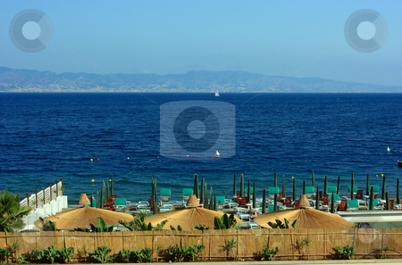To use this stock image in your creative project, please select the size you need over to the right and click the "Add to Cart" button.
Your downloaded image will come with the Cutcaster watermark removed so don’t worry about the watermark you see on this page. Beach against Sicily stock photo, Beach in Reggio Calabria with the view on Messina strait by Natalia Macheda
