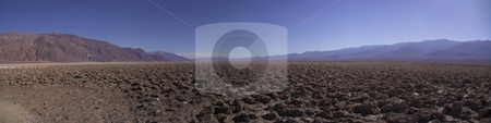 To use this stock image in your creative project, please select the size you need over to the right and click the "Add to Cart" button.
Your downloaded image will come with the Cutcaster watermark removed so don’t worry about the watermark you see on this page. Devil's Golf Course stock photo, A panoramic view of Death Valley's