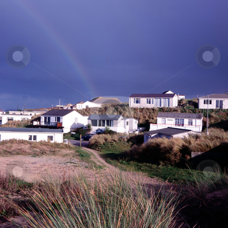 To use this stock image in your creative project, please select the size you need over to the right and click the "Add to Cart" button.
Your downloaded image will come with the Cutcaster watermark removed so don’t worry about the watermark you see on this page. MPIXIS250303 stock photo, Rainbow over coastal village by Mpixis World