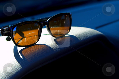 To use this stock image in your creative project, please select the size you need over to the right and click the "Add to Cart" button.
Your downloaded image will come with the Cutcaster watermark removed so don’t worry about the watermark you see on this page. Sunglasses stock photo, A pair of sunglasses on a car dashboard. by Robert Byron