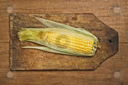 To use this stock image in your creative project, please select the size you need over to the right and click the "Add to Cart" button.
Your downloaded image will come with the Cutcaster watermark removed so don’t worry about the watermark you see on this page. Corn on the cob stock photo, Corn on the cob, isolated on wooden table. by Pablo Caridad