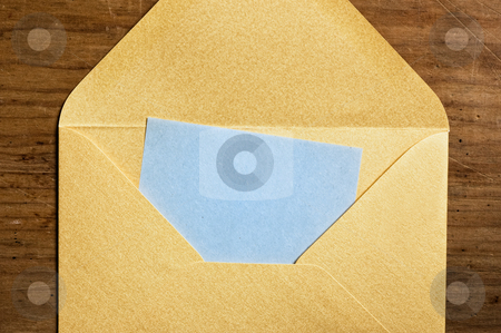 To use this stock image in your creative project, please select the size you need over to the right and click the "Add to Cart" button.
Your downloaded image will come with the Cutcaster watermark removed so don’t worry about the watermark you see on this page. Open golden envelope stock photo, Open golden envelope with blue paper inside. by Pablo Caridad