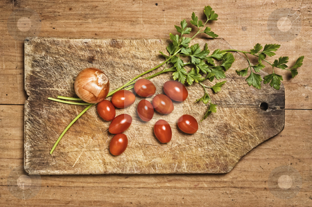 To use this stock image in your creative project, please select the size you need over to the right and click the "Add to Cart" button.
Your downloaded image will come with the Cutcaster watermark removed so don’t worry about the watermark you see on this page. Tomato, parsley and onion on wooden table. stock photo, Tomato, parsley and onion on wooden table. by Pablo Caridad