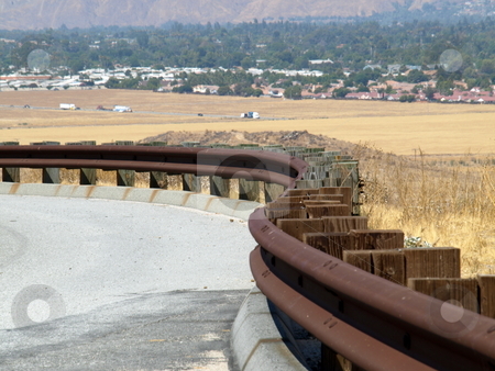 To use this stock image in your creative project, please select the size you need over to the right and click the "Add to Cart" button.
Your downloaded image will come with the Cutcaster watermark removed so don’t worry about the watermark you see on this page. Rusted Railing Curves stock photo, Rusted Railing curves down road by Joseph Ligori