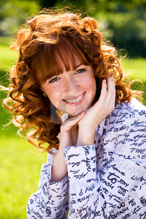 To use this stock image in your creative project, please select the size you need over to the right and click the "Add to Cart" button.
Your downloaded image will come with the Cutcaster watermark removed so don’t worry about the watermark you see on this page. Bright portrait of red-haired young woman outdoors stock photo, Close-up bright portrait of red-haired lovely young woman outdoors by Vitaly Sokolovskiy