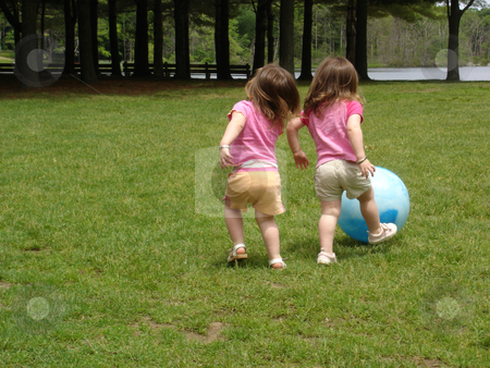 To use this stock image in your creative project, please select the size you need over to the right and click the "Add to Cart" button.
Your downloaded image will come with the Cutcaster watermark removed so don’t worry about the watermark you see on this page. Girls Playing Ball stock photo, Girls playing ball at a park by Bill Parmentier