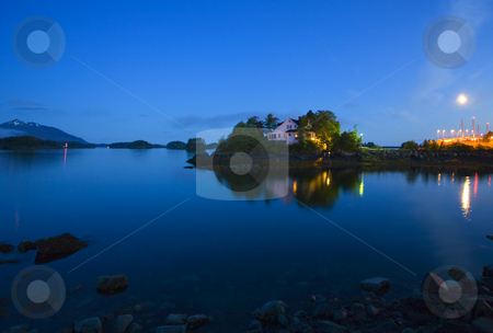 To use this stock image in your creative project, please select the size you need over to the right and click the "Add to Cart" button.
Your downloaded image will come with the Cutcaster watermark removed so don’t worry about the watermark you see on this page. Moonrise over Sitka Harbor stock photo, The moon rising over the calm waters of Sitka Harbor in Alaska by Mike Dawson