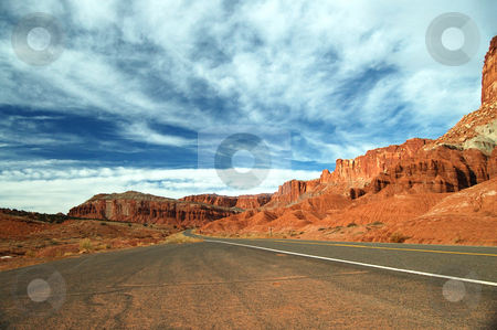 To use this stock image in your creative project, please select the size you need over to the right and click the "Add to Cart" button.
Your downloaded image will come with the Cutcaster watermark removed so don’t worry about the watermark you see on this page. Roadway to Heaven stock photo, An endless roadway through the deserted Capitol Reef national park at Utah taken during early winter by Nilanjan Bhattacharya