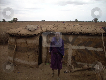 To use this stock image in your creative project, please select the size you need over to the right and click the "Add to Cart" button.
Your downloaded image will come with the Cutcaster watermark removed so don’t worry about the watermark you see on this page. Masai Man standing in front of his hut stock photo, A Masai elder standing in front of his traditional hut which is made of mud and cowdung. by Rose Nthiwa