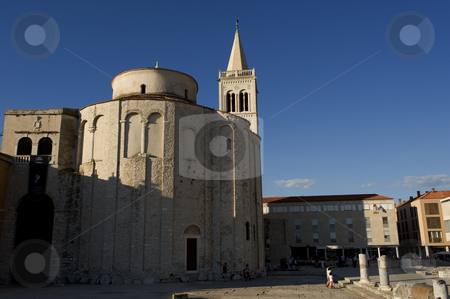 To use this stock image in your creative project, please select the size you need over to the right and click the "Add to Cart" button.
Your downloaded image will come with the Cutcaster watermark removed so don’t worry about the watermark you see on this page. Church of St. Donat, Zadar stock photo, The Church of St. Donat in the center of the historical city Zadaron the vest coast of Croatia.
St. Donat is the most monumental Croatian building from the early Middle Ages. It is the most well-known monument of Zadar and indeed a symbol of the city. It was constructed on the intiative of the bishop of Zadar, Donat, who between the years 801 and 814 played an important role, visiting both of the reigning European courts, the Frankish and the Bizantine. The church is mentioned for the first time in the middle of the 10th century in the documents of the Bizantine emperor Constantine Porfirogenet. Today its interior and the area connected to the Forum are used for various cultural-theatrical and musical programs, especially during the summer months of the tourist season. by Flemming Jacobsen