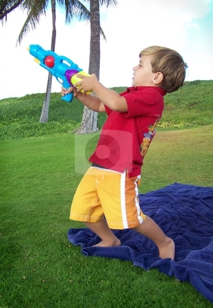 To use this stock image in your creative project, please select the size you need over to the right and click the "Add to Cart" button.
Your downloaded image will come with the Cutcaster watermark removed so don’t worry about the watermark you see on this page. Boy with toy gun in paradise stock photo, Boy with toy gun in paradise by Peter Rolfe