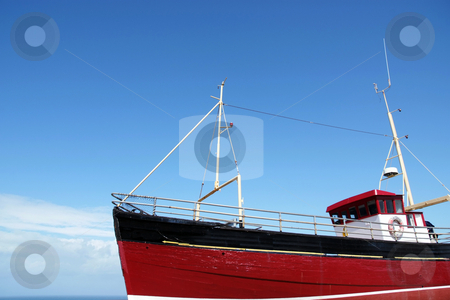 To use this stock image in your creative project, please select the size you need over to the right and click the "Add to Cart" button.
Your downloaded image will come with the Cutcaster watermark removed so don’t worry about the watermark you see on this page. Sea fishing stock photo, Bright red fishing boat at sea by Paul Phillips