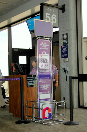 To use this stock image in your creative project, please select the size you need over to the right and click the "Add to Cart" button.
Your downloaded image will come with the Cutcaster watermark removed so don’t worry about the watermark you see on this page. Airport lounge has a sign for checking your carry on luggage sizes. stock photo, Airport signage in a gate loung helps passengers determine if their carry on luggage is the correct size. Hawaii airport by Janie Mertz