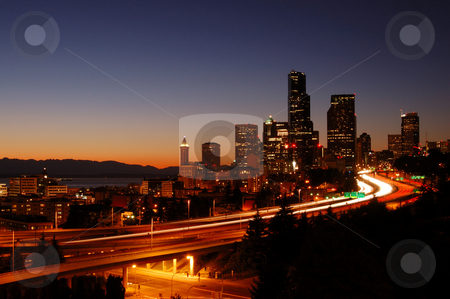 To use this stock image in your creative project, please select the size you need over to the right and click the "Add to Cart" button.
Your downloaded image will come with the Cutcaster watermark removed so don’t worry about the watermark you see on this page. Cityscape and freeways stock photo, A beautifully illuminated painting like night shot of downtown Seattle with the freeways in foreground by Nilanjan Bhattacharya