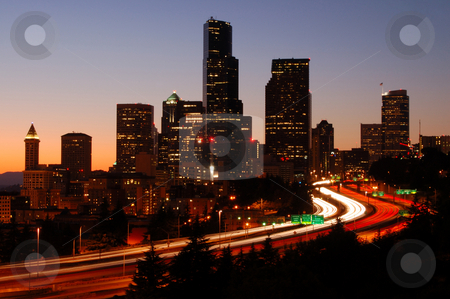 To use this stock image in your creative project, please select the size you need over to the right and click the "Add to Cart" button.
Your downloaded image will come with the Cutcaster watermark removed so don’t worry about the watermark you see on this page. Silhoutted Seattle downtown stock photo, A silhouttle of the Seattle downtown with colorful freeways in foreground by Nilanjan Bhattacharya