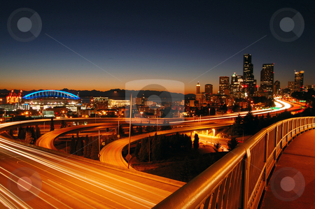 To use this stock image in your creative project, please select the size you need over to the right and click the "Add to Cart" button.
Your downloaded image will come with the Cutcaster watermark removed so don’t worry about the watermark you see on this page. Seattle Freeways stock photo, A night shot of freeways and Seattle downtown at the background by Nilanjan Bhattacharya