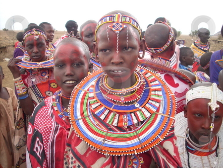 To use this stock image in your creative project, please select the size you need over to the right and click the "Add to Cart" button.
Your downloaded image will come with the Cutcaster watermark removed so don’t worry about the watermark you see on this page. Beautiful Masai Girl in tradional dress stock photo, Beautiful Masai girl in traditional dress standing in a crowd. by Rose Nthiwa