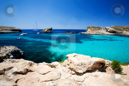 To use this stock image in your creative project, please select the size you need over to the right and click the "Add to Cart" button.
Your downloaded image will come with the Cutcaster watermark removed so don’t worry about the watermark you see on this page. Blue Lagoon stock photo, Blue lagoon swimming cove, Comino island. by Tyler Olson