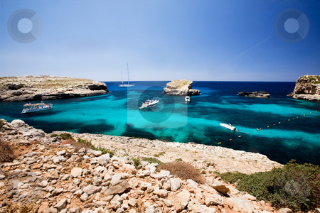 To use this stock image in your creative project, please select the size you need over to the right and click the "Add to Cart" button.
Your downloaded image will come with the Cutcaster watermark removed so don’t worry about the watermark you see on this page. Blue Lagoon stock photo, Blug lagoon on a warm summer day on Comino Island, Malta by Tyler Olson