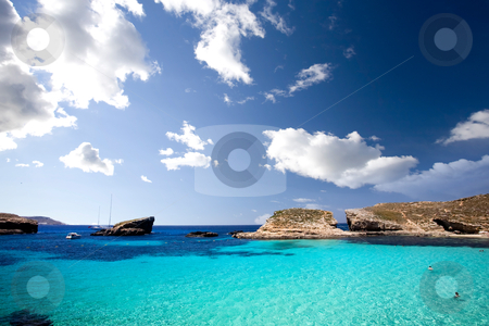 To use this stock image in your creative project, please select the size you need over to the right and click the "Add to Cart" button.
Your downloaded image will come with the Cutcaster watermark removed so don’t worry about the watermark you see on this page. Blue Lagoon stock photo, Blue lagoon in Malta on the island of Comino by Tyler Olson