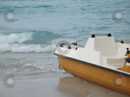 To use this stock image in your creative project, please select the size you need over to the right and click the "Add to Cart" button.
Your downloaded image will come with the Cutcaster watermark removed so don’t worry about the watermark you see on this page. Yellow paddle boat on the ocean stock photo, by Mbudley Mbudley