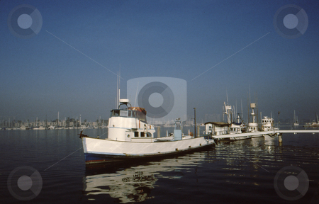 To use this stock image in your creative project, please select the size you need over to the right and click the "Add to Cart" button.
Your downloaded image will come with the Cutcaster watermark removed so don’t worry about the watermark you see on this page. Fishing Boat early morning stock photo, Fishing boat and reflection in deep blue water in early morning light by Joseph Ligori