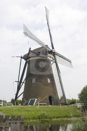 To use this stock image in your creative project, please select the size you need over to the right and click the "Add to Cart" button.
Your downloaded image will come with the Cutcaster watermark removed so don’t worry about the watermark you see on this page. Dutch Windmill stock photo, Dutch windmill at Kinderdijk, South Holland by Inge Schepers