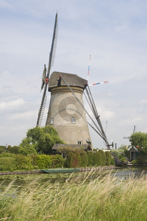 To use this stock image in your creative project, please select the size you need over to the right and click the "Add to Cart" button.
Your downloaded image will come with the Cutcaster watermark removed so don’t worry about the watermark you see on this page. Dutch Windmill stock photo, Dutch windmill with a canal in the foreground by Inge Schepers