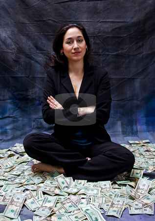 To use this stock image in your creative project, please select the size you need over to the right and click the "Add to Cart" button.
Your downloaded image will come with the Cutcaster watermark removed so don’t worry about the watermark you see on this page. Woman sitting in money stock photo, Rich woman sitting with crossed arms in money isolated on a dark background by Paul Hakimata