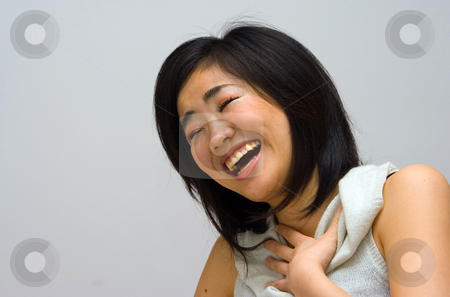 To use this stock image in your creative project, please select the size you need over to the right and click the "Add to Cart" button.
Your downloaded image will come with the Cutcaster watermark removed so don’t worry about the watermark you see on this page. Laughing Oriental woman stock photo, Beautifull Oriental woman in a white collared shirt laughing by Paul Hakimata