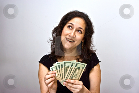 To use this stock image in your creative project, please select the size you need over to the right and click the "Add to Cart" button.
Your downloaded image will come with the Cutcaster watermark removed so don’t worry about the watermark you see on this page. Counting money stock photo, Women counting money and thinking what she can do with it by Paul Hakimata