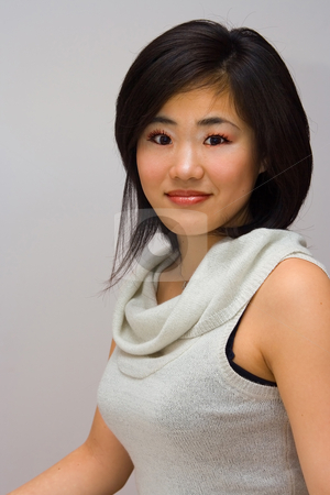 To use this stock image in your creative project, please select the size you need over to the right and click the "Add to Cart" button.
Your downloaded image will come with the Cutcaster watermark removed so don’t worry about the watermark you see on this page. Beautiful Oriental woman stock photo, Beautifull Oriental woman in a white collared shirt by Paul Hakimata