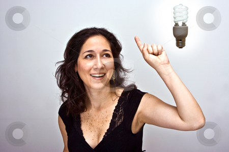 To use this stock image in your creative project, please select the size you need over to the right and click the "Add to Cart" button.
Your downloaded image will come with the Cutcaster watermark removed so don’t worry about the watermark you see on this page. Great idea symbol stock photo, Woman having a brilliant environmentally friendly idea by Paul Hakimata
