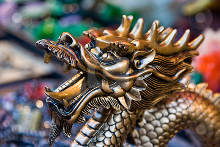 To use this stock image in your creative project, please select the size you need over to the right and click the "Add to Cart" button.
Your downloaded image will come with the Cutcaster watermark removed so don’t worry about the watermark you see on this page. Golden dragon stock photo, A statue of a golden dragon's head by Paul Hakimata