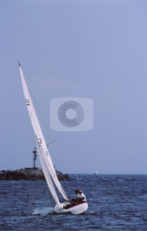 To use this stock image in your creative project, please select the size you need over to the right and click the "Add to Cart" button.
Your downloaded image will come with the Cutcaster watermark removed so don’t worry about the watermark you see on this page. Sail in harbor stock photo, Sail craft leaned over catching full wind in harbor by Joseph Ligori