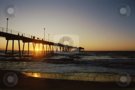 To use this stock image in your creative project, please select the size you need over to the right and click the "Add to Cart" button.
Your downloaded image will come with the Cutcaster watermark removed so don’t worry about the watermark you see on this page. Pier at sunset stock photo, Pier at sunset casting a magical glow to the pier and water by Joseph Ligori