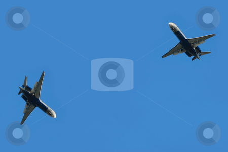 To use this stock image in your creative project, please select the size you need over to the right and click the "Add to Cart" button.
Your downloaded image will come with the Cutcaster watermark removed so don’t worry about the watermark you see on this page. Two flying planes stock photo, Two flying planes isolated over blue sky by Julija Sapic
