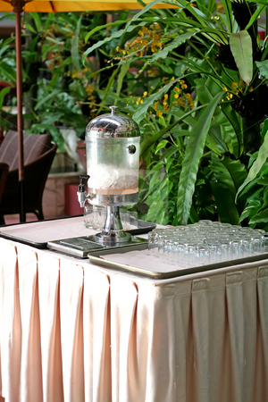 To use this stock image in your creative project, please select the size you need over to the right and click the "Add to Cart" button.
Your downloaded image will come with the Cutcaster watermark removed so don’t worry about the watermark you see on this page. Drink dispenser stock photo, Drink dispenser and glasses in a hotel with ice by Kheng Guan Toh