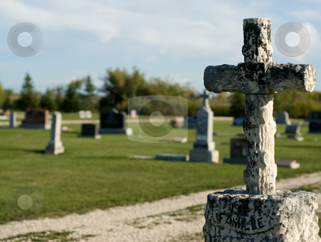 To use this stock image in your creative project, please select the size you need over to the right and click the "Add to Cart" button.
Your downloaded image will come with the Cutcaster watermark removed so don’t worry about the watermark you see on this page. Graveyard stock photo, A rural graveyard or cemetery shot during the day by Richard Nelson