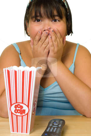 To use this stock image in your creative project, please select the size you need over to the right and click the "Add to Cart" button.
Your downloaded image will come with the Cutcaster watermark removed so don’t worry about the watermark you see on this page. Scary Movie stock photo, A young girl watching a scary movie alone by Richard Nelson